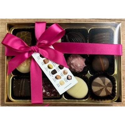 Luxury Belgian chocolate gift box containing 12 assorted milk, dark and white filled chocolates, presented in a gold box with a pink satin ribbon.